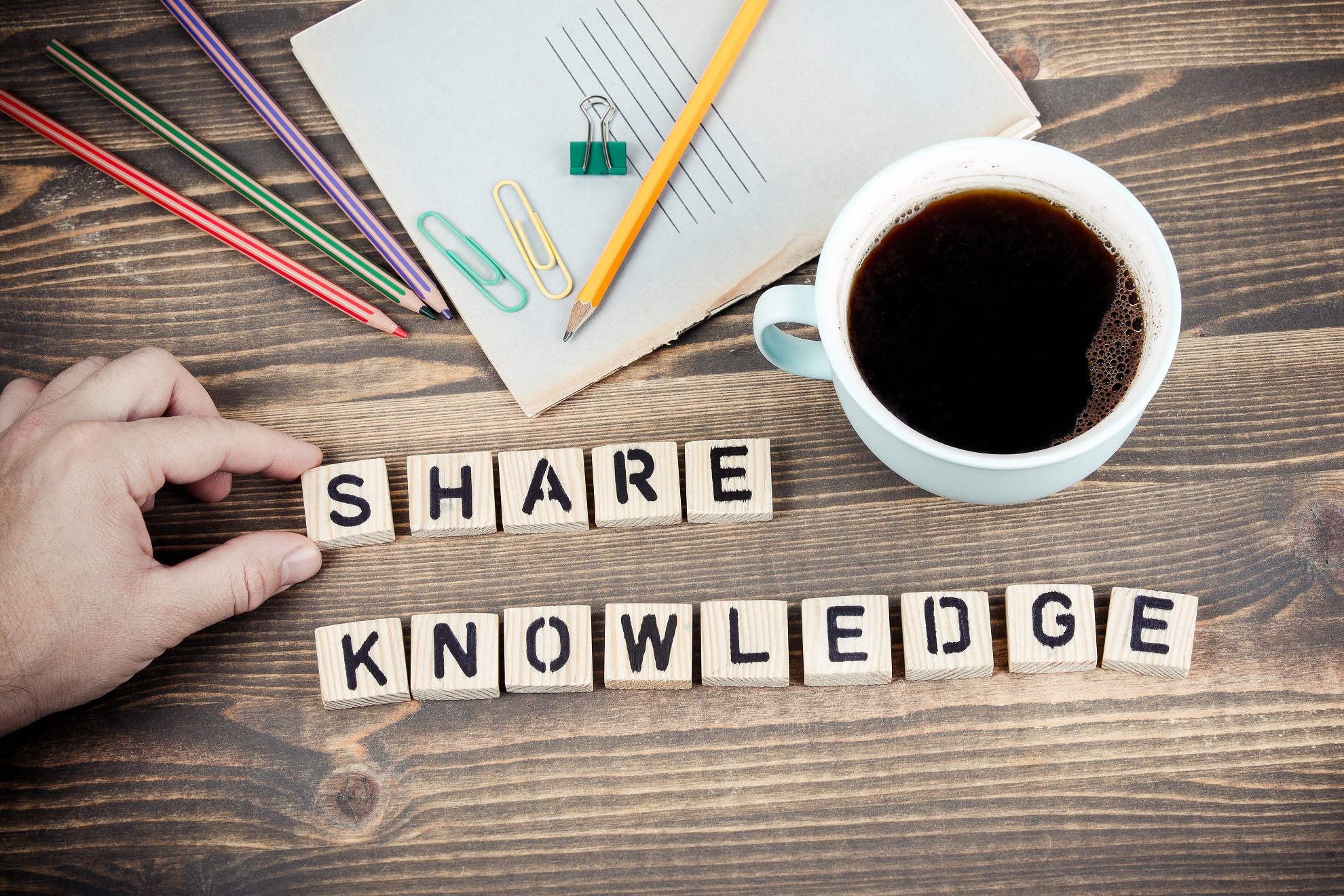 Share Knowledge. Wooden letters on the office desk, informative and communication background