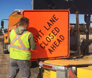 This winner of the Illinois Innovative Ideas Contest is a work zone sign holder for Truck Mounted Attenuators (TMA) that rotates to the side for installation, thereby increasing safety and avoiding damage to the TMA frame.